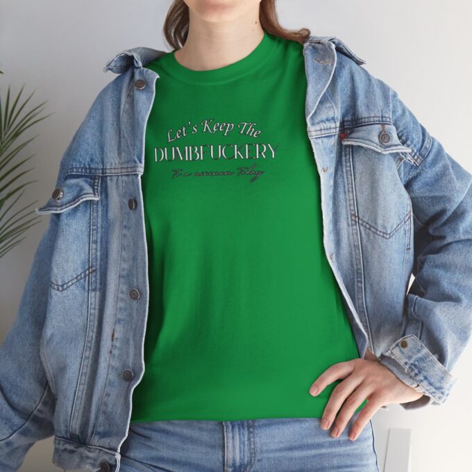 A woman wearing a green shirt and jeans