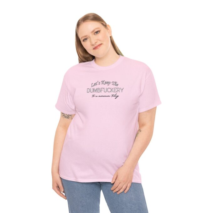 A woman wearing a pink t-shirt with the words " i am a surfer girl ".