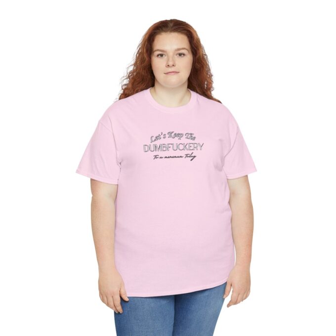 A woman wearing a pink t-shirt with the words " i am proud of handicapped."