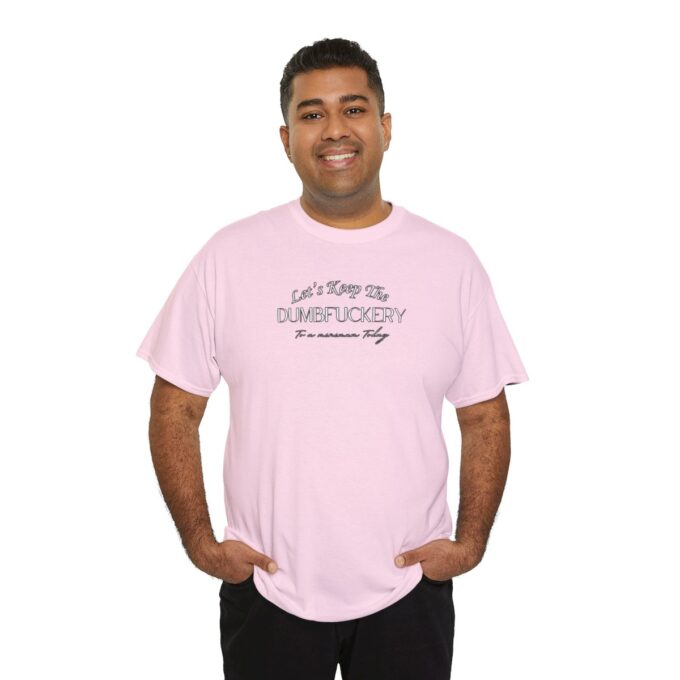 A man wearing a pink t-shirt with the words " let 's have fun."
