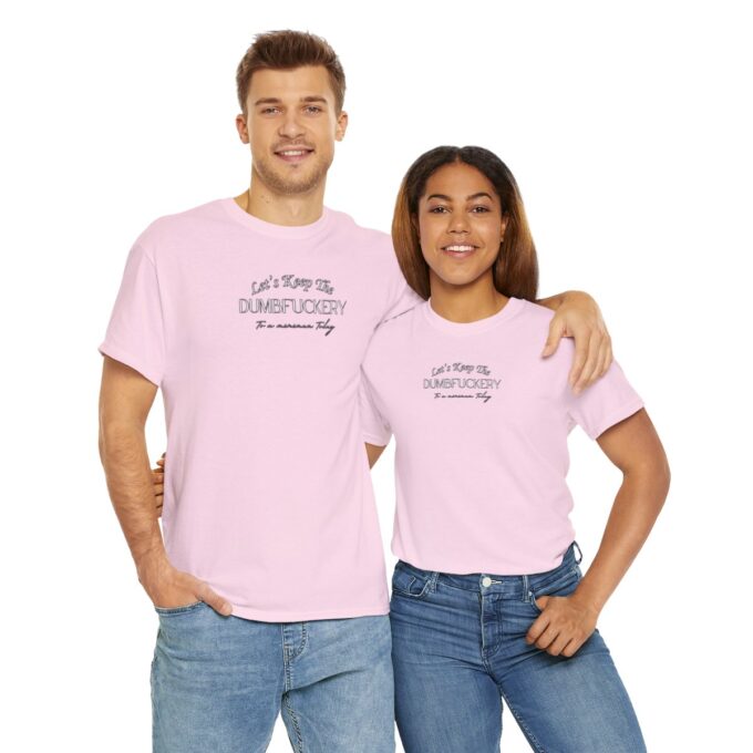 A man and woman wearing matching pink shirts.