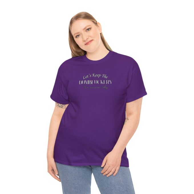 A woman wearing purple shirt and jeans.