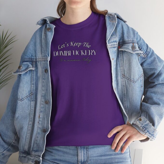 A woman wearing a purple shirt and jacket