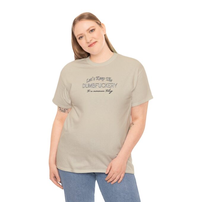 A woman wearing jeans and a t-shirt with the words " you can 't see me " on it.