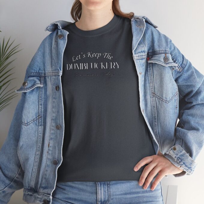 A woman wearing a jean jacket and t-shirt.