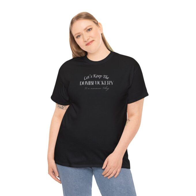 A woman wearing jeans and black t-shirt with text.
