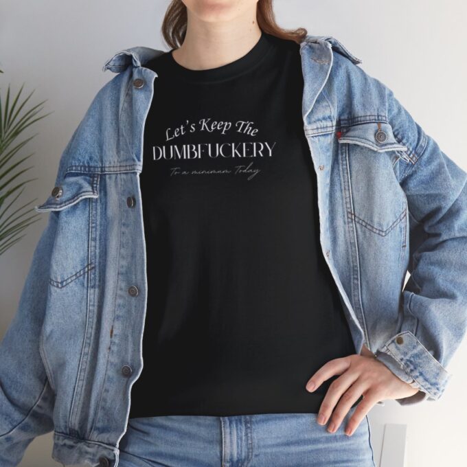 A woman wearing a black t-shirt and jeans.