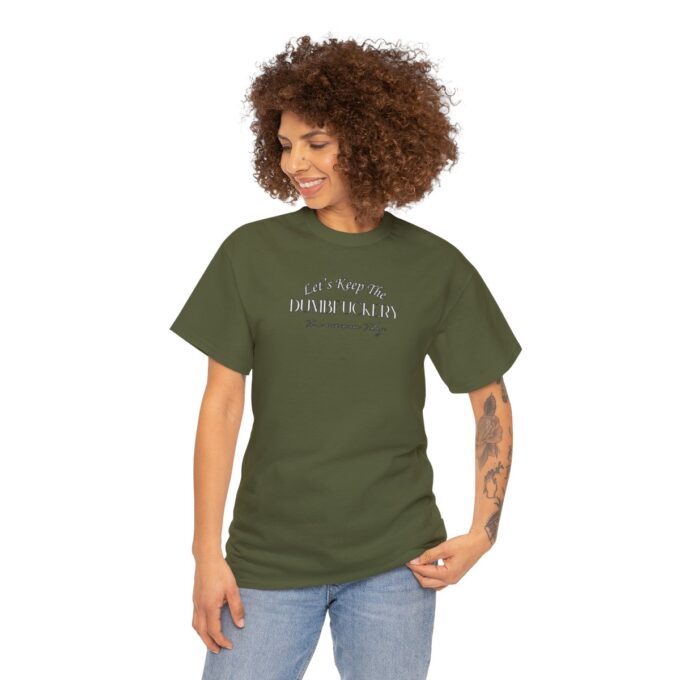 A woman is wearing a green shirt and jeans.