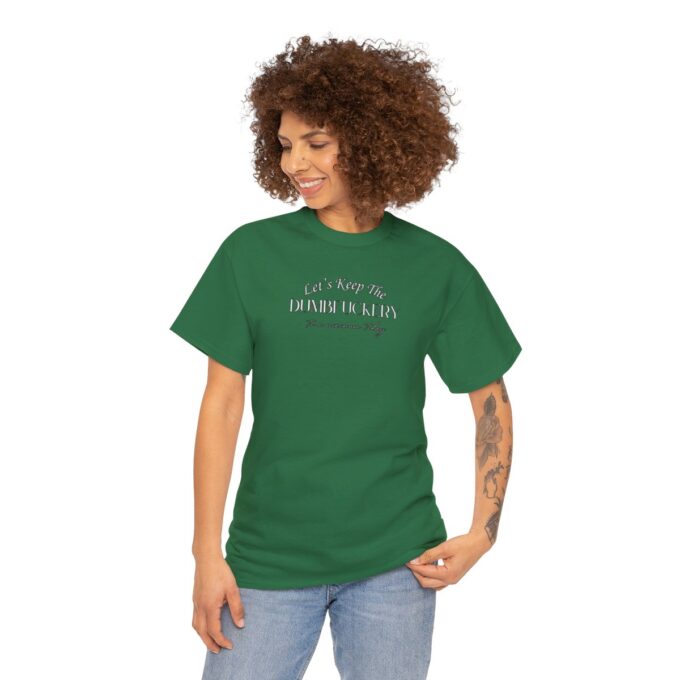 A woman is wearing a green shirt and has her hair in front of her face.