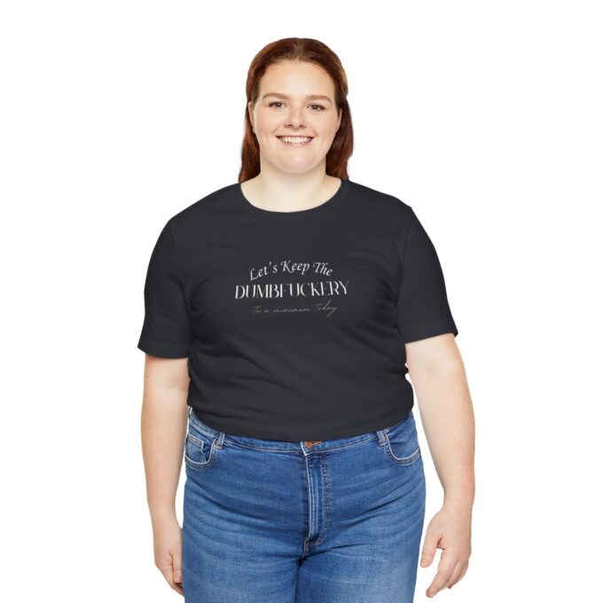 A woman wearing jeans and black t-shirt with words on it.