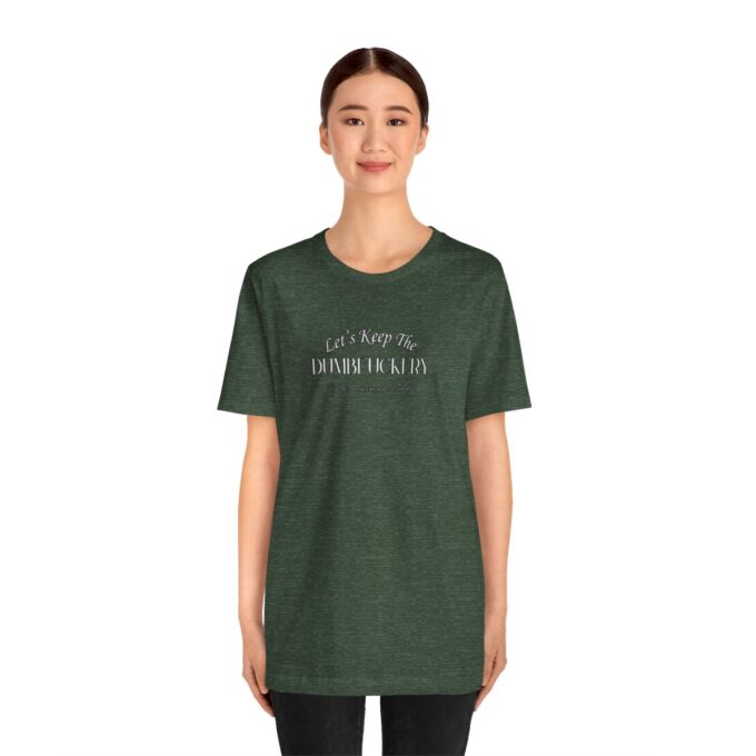 A woman wearing a green t-shirt with the words " i am not a terrorist ".