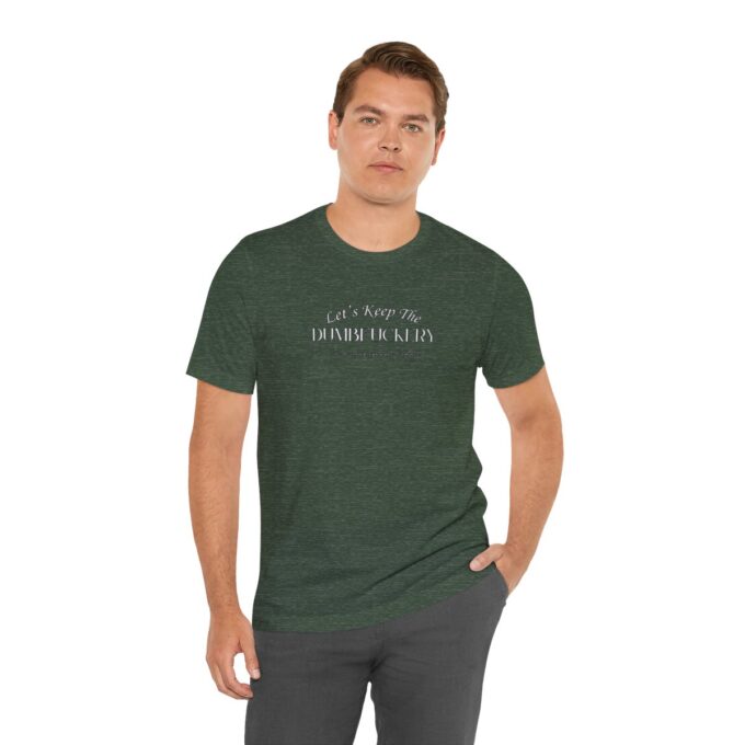 A man wearing a green shirt and grey pants.