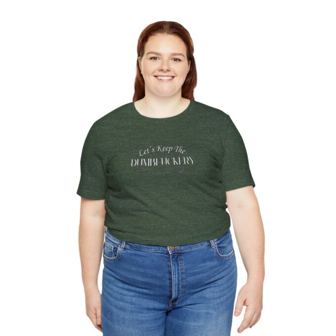 A woman wearing jeans and green shirt with words on it.