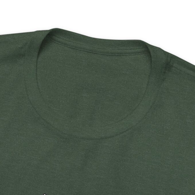 A close up of the neck and sleeve of a green shirt
