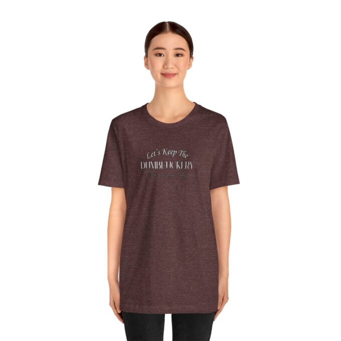 A woman wearing a brown t-shirt with the words " i am not an individual ".