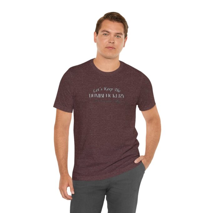 A man wearing a maroon t-shirt with the words " let them be light ".