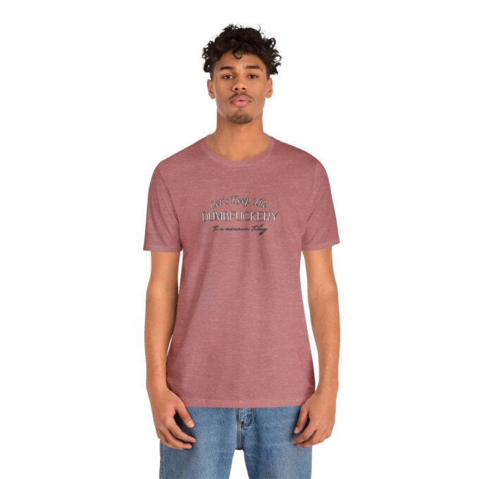 A man wearing a t-shirt with the word " roots ".