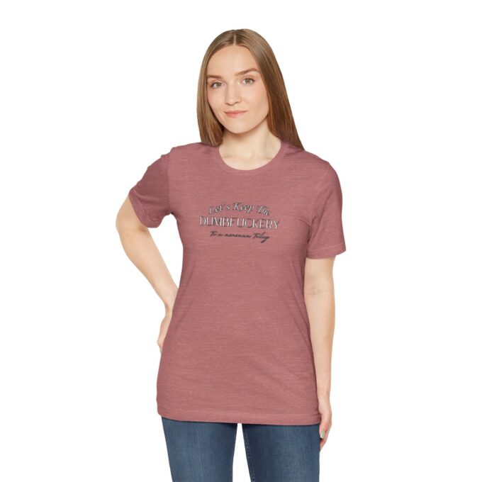 A woman wearing a t-shirt with the words " the road is always ahead ".