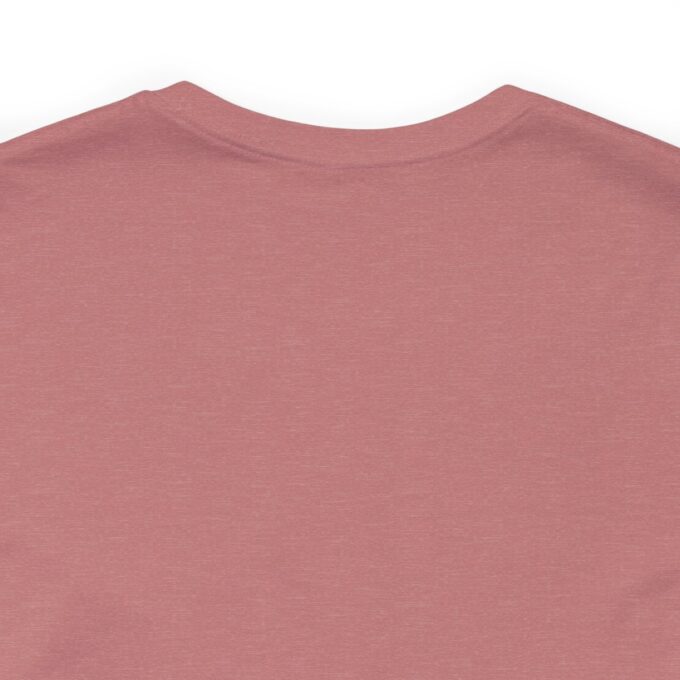 A close up of the chest area of a pink shirt