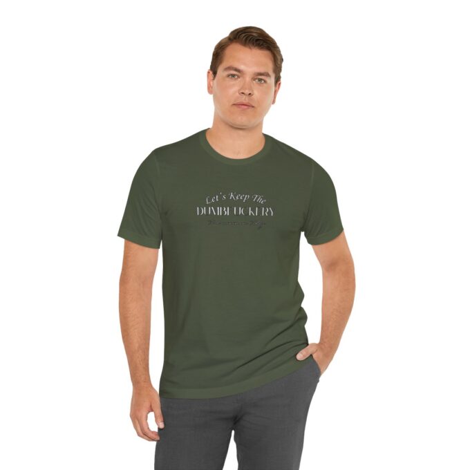 A man wearing a green shirt and grey pants.