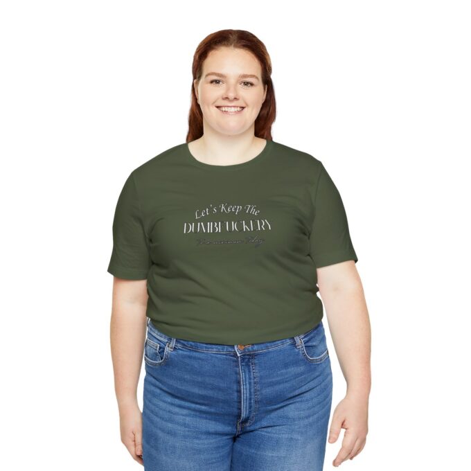A woman wearing jeans and green shirt with words