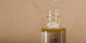 A bottle of liquid with a dropper in it.